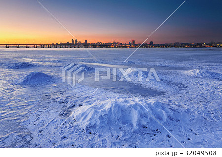 Beautiful winter landscape with frozen river at 32049508