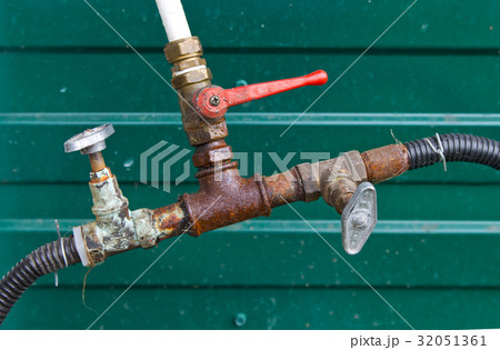 Connection hoses, old rusty plumbing valves 32051361