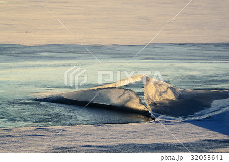 Ice figure in the rays of the setting sun. 32053641