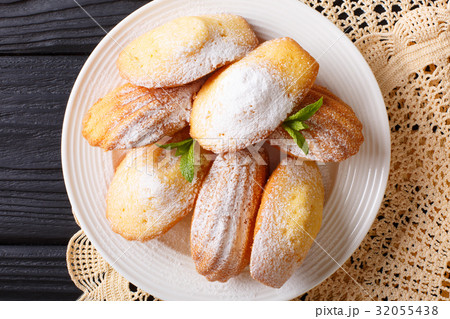 Madeleine's biscuit with powdered sugar Madeleine's biscuit with powdered sugar 32055438
