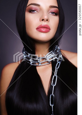 Beautiful woman with long hair in chain 32056007