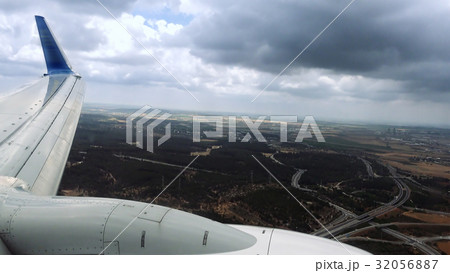 Airliner is landing in a bad weather conditions Airliner is landing in a bad weather conditions 32056887