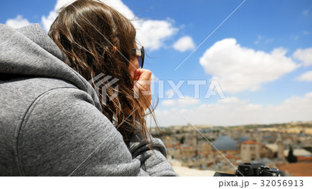 Longhair woman with flying hair outdoors 32056913