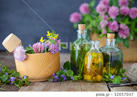 Bottles of tincture or infusion of healthy herbs. 32057037