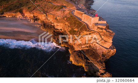 Aerial view of ocean and Nazare lighthouse at 32060664