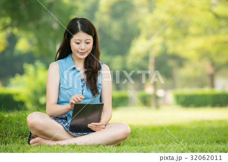 asian woman using digital tablet shopping asian woman using digital tablet shopping 32062011