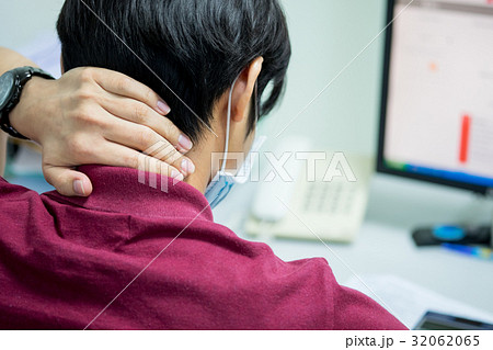 Man feeling pain on back of his neck 32062065