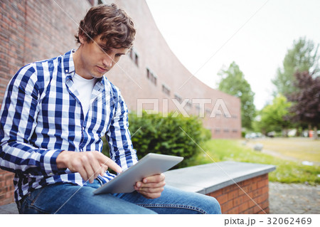Student using digital tablet in campus 32062469
