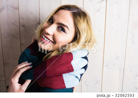 Portrait of smiling woman posing against texture background 32062503