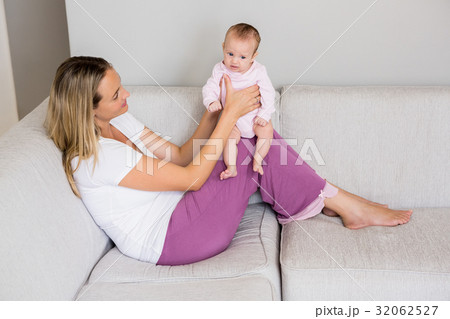 Mother playing with her baby Mother playing with her baby 32062527