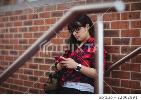 Female student using mobile phone 32062891