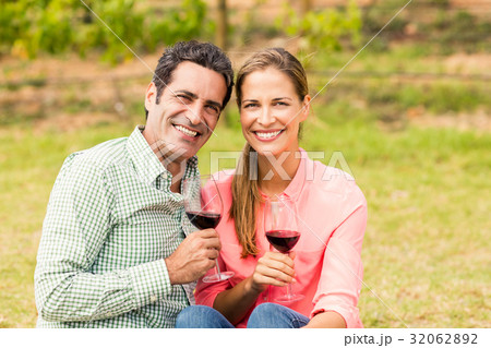 Happy couple holding glasses of wine 32062892