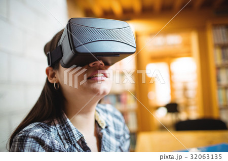 Female student using virtual reality headset 32063135
