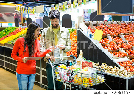 Couple using digital tablet while shopping Couple using digital tablet while shopping 32063153