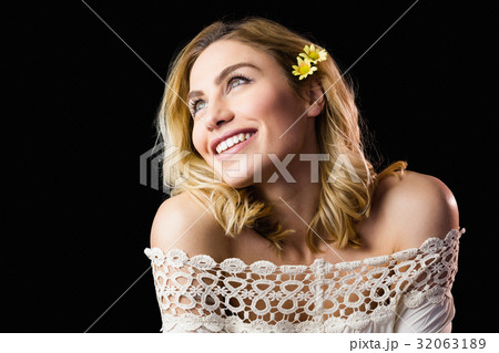 Beautiful smiling woman against black background Beautiful smiling woman against black background 32063189