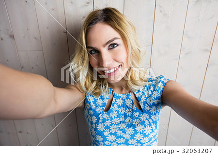 Portrait of smiling woman posing against texture background Portrait of smiling woman posing against texture background 32063207