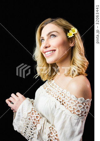 Beautiful smiling woman against black background Beautiful smiling woman against black background 32063441