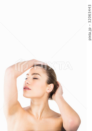 Beautiful woman posing against white background 32063443