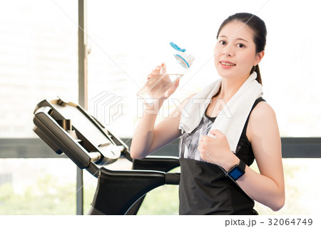 Beautiful asian woman rest holding water bottle Beautiful asian woman rest holding water bottle 32064749
