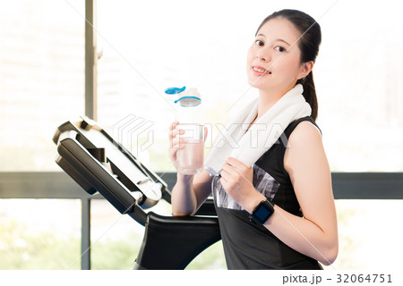 Beautiful asian woman rest holding water bottle 32064751