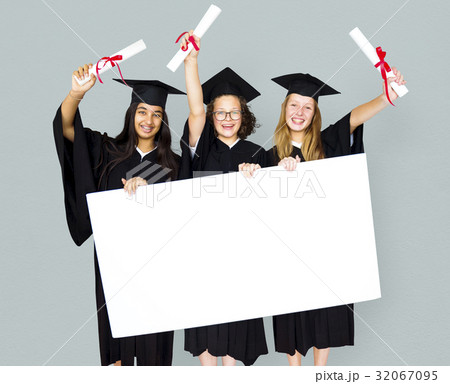 Diverse Students wearing Cap and Gown Showing Blank Copy Space Studio Portrait Diverse Students wearing Cap and Gown Showing Blank Copy Space Studio Portrait 32067095