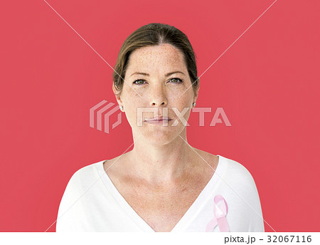 Woman with pink ribbon for breast cancer awareness charity studio portrait 32067116