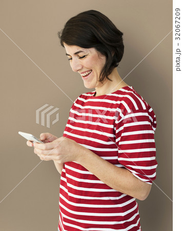 Adult Woman Using Mobile Phone Cheerfully Adult Woman Using Mobile Phone Cheerfully 32067209