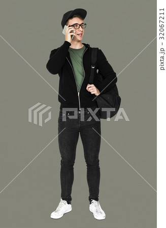 Young man with casual outfit talking phone standing Young man with casual outfit talking phone standing 32067211