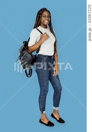 Young adult girl smiling and carrying bag Young adult girl smiling and carrying bag 32067220