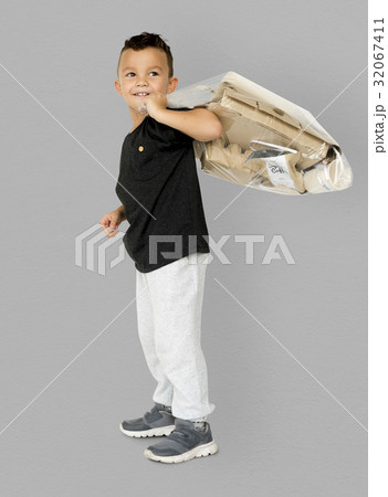 Little Boy Holding Separate Papers Studio Portrait Little Boy Holding Separate Papers Studio Portrait 32067411