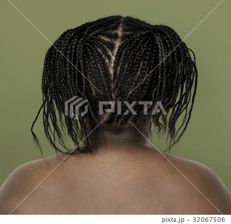 Little african girl shirtless studio portrait in rear view 32067506