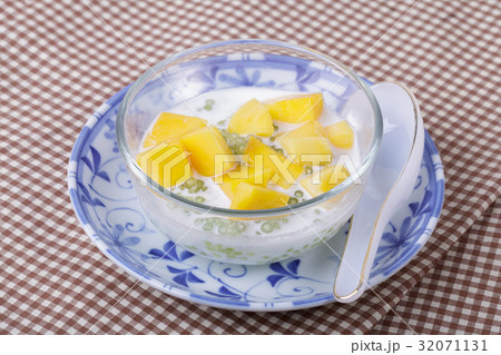 Thai dessert of sago with coconut milk and mango Thai dessert of sago with coconut milk and mango 32071131