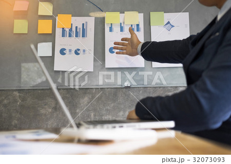 Business man speaker giving a talk finance profit graph presenta 32073093