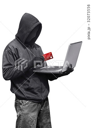 Hacker man wearing anonymous mask holding laptop 32073556