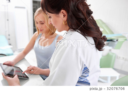 Beautiful young woman visiting doctor Beautiful young woman visiting doctor 32076706