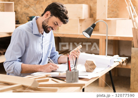 Cheerful youthful lumber master making 32077590