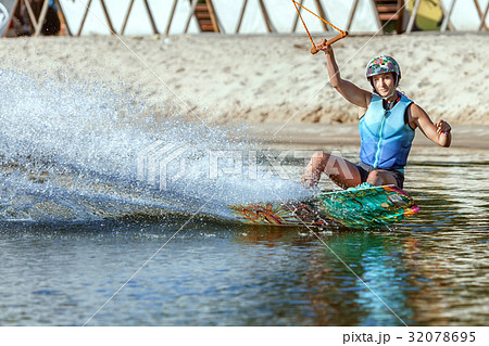 Woman athlete on a wakeboard. 32078695