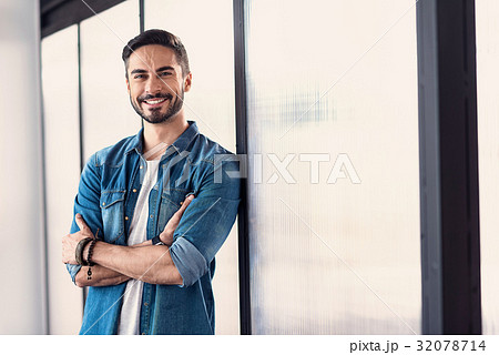 Cheerful smiling male person in room Cheerful smiling male person in room 32078714