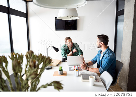 Interested smiling workers in office 32078753