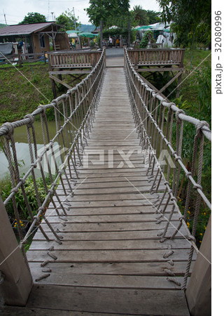 Rope suspension wooden bridge 32080996