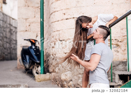 Happy young couple lovestory in city. 32082184