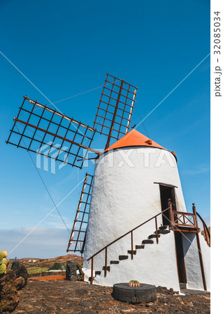 Windmill in cactus garden in Guatiza village Windmill in cactus garden in Guatiza village 32085034