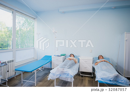 Female patient sleeping in medical bed at the 32087057