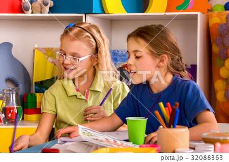 Small student child painting in art school class. 32088363