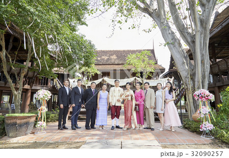 Guests are taking photo with groom and bride. Guests are taking photo with groom and bride. 32090257