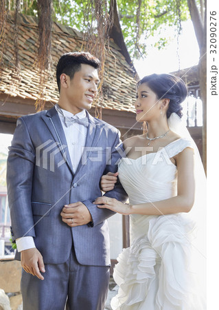 A photo of a couple with wedding clothes. 32090276