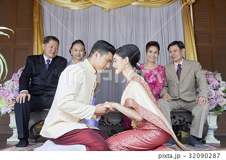 a couple is facing and holding hand each other a couple is facing and holding hand each other 32090287