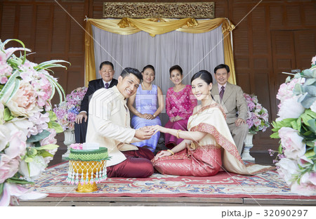 people are sitting, looking at camera and smiling people are sitting, looking at camera and smiling 32090297