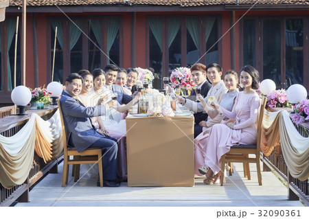 Relatives are toasting for young couple 's wedding Relatives are toasting for young couple 's wedding 32090361