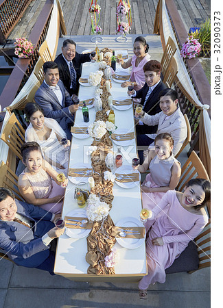 everyone in a wedding is toasting and looking at the sky everyone in a wedding is toasting and looking at the sky 32090373